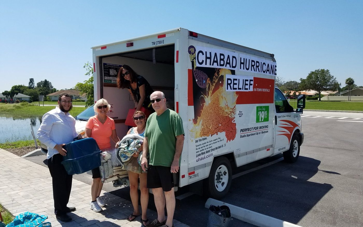 Volunteers loading supplies from a Chabad hurricane relief truck
