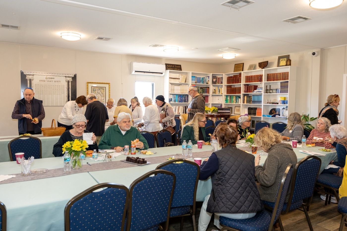 Women gathered around the table at the book club