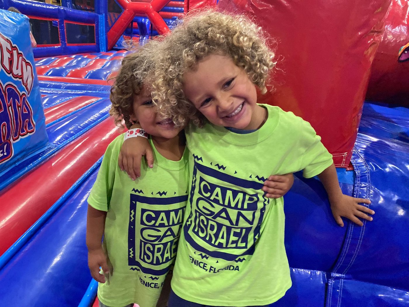 Two Gan Izzy campers laughing together