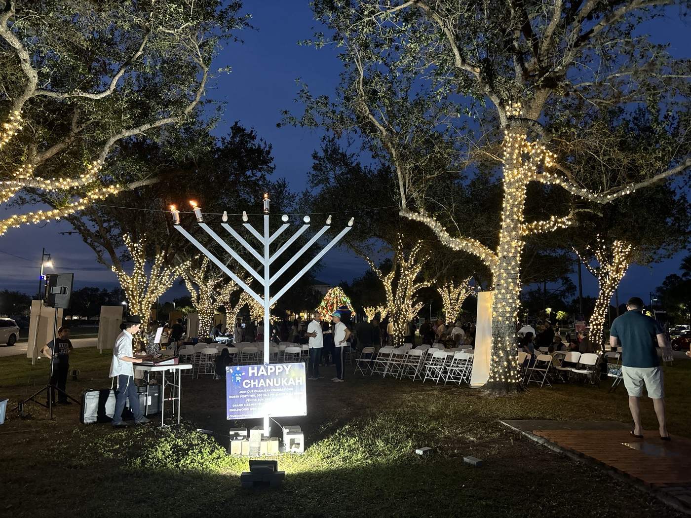 Public menorah lighting at night