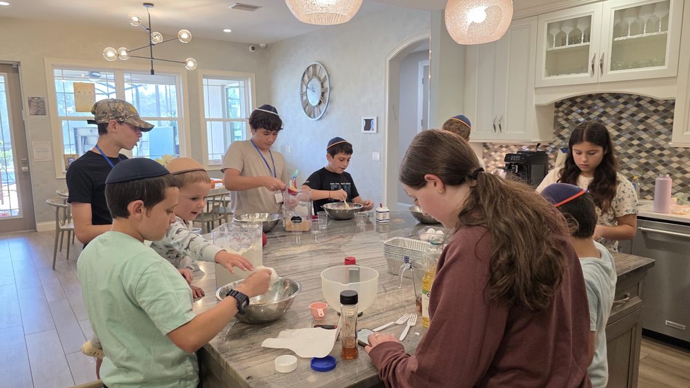 Teens in the kitchen at a CTeen night