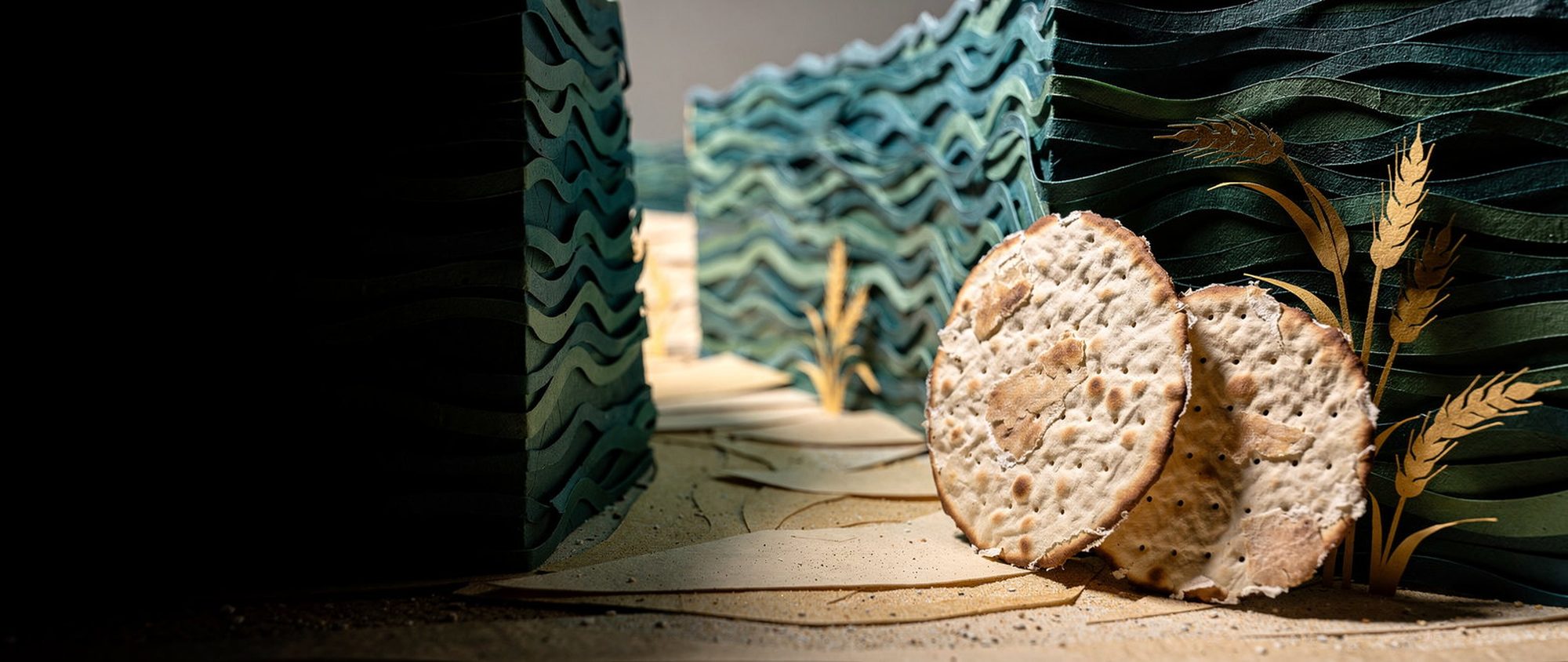 Papercut walls of water parted around round hand-baked shmurah matzot