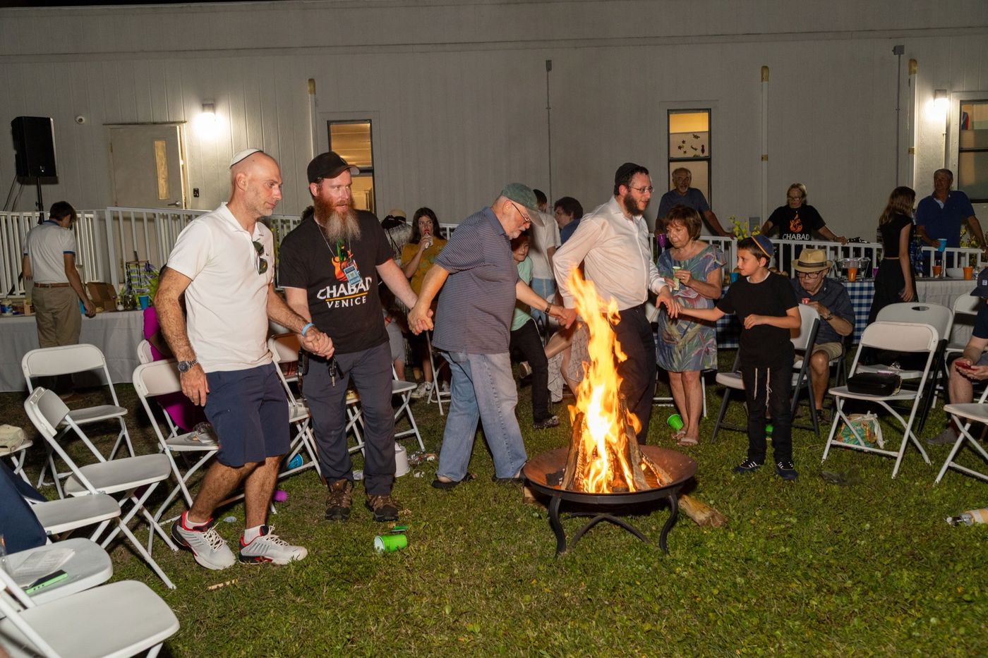 Dancing around the bonfire at night