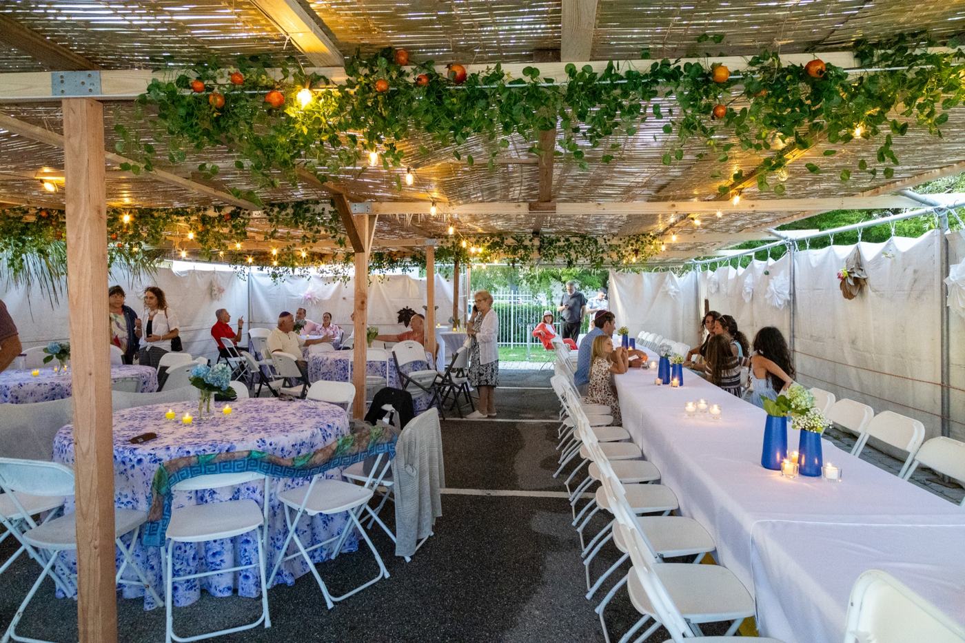 Inside the community sukkah, set for a holiday meal