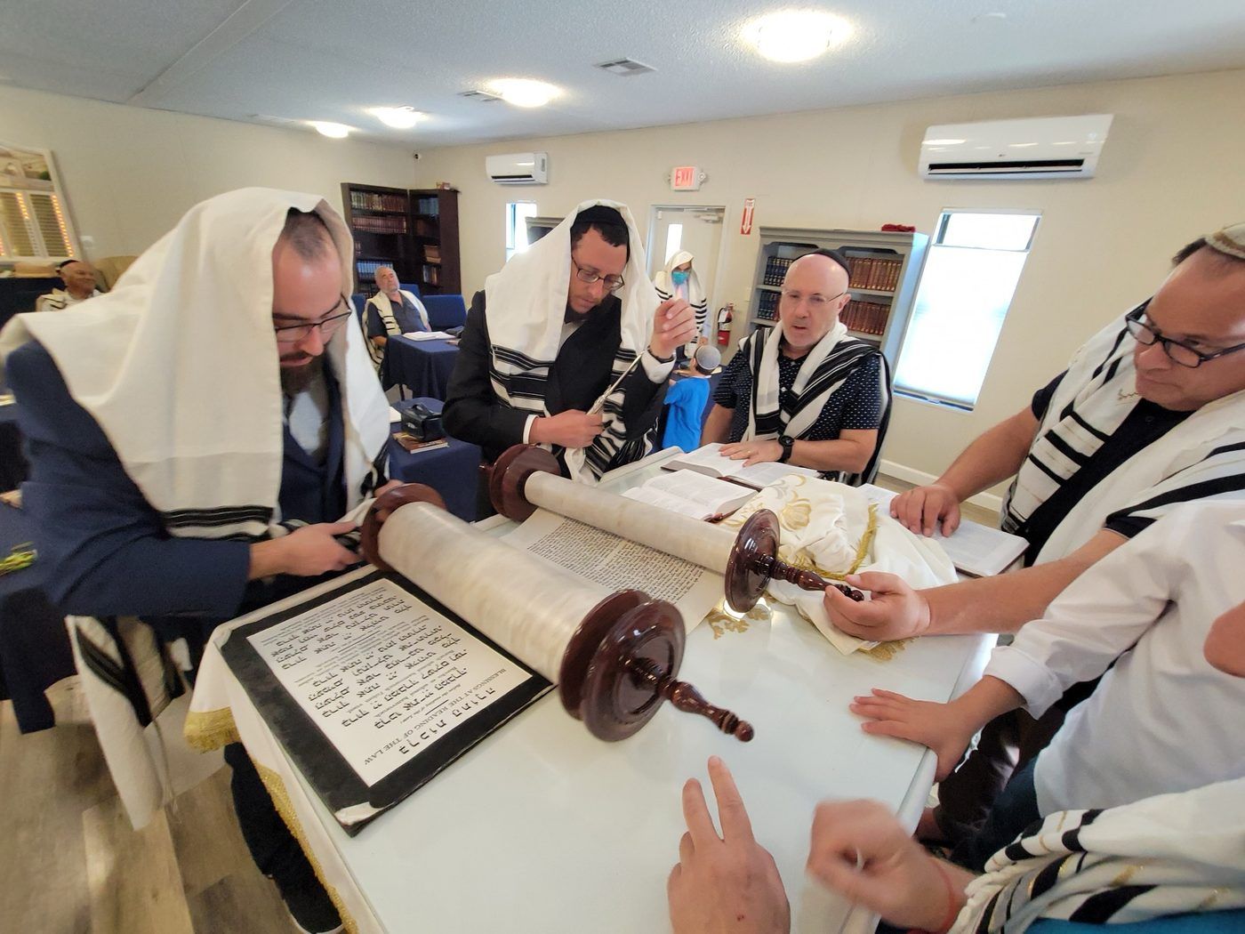 An open Sefer Torah, the written columns of letters visible